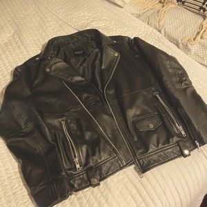 Used large men’s leather biker jacket.